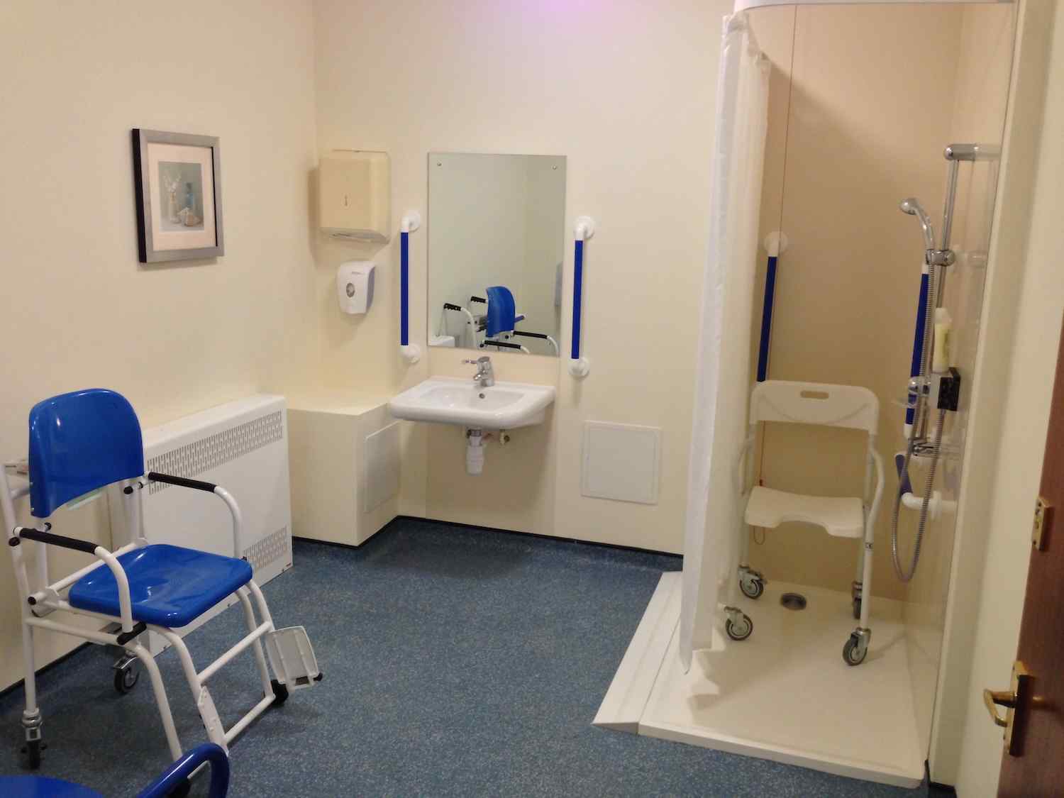 bathroom with wetroom and assistive equipment